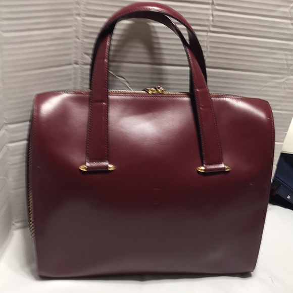 Cartier Handbags - Cartier zip around burgundy leather satchel. EUC